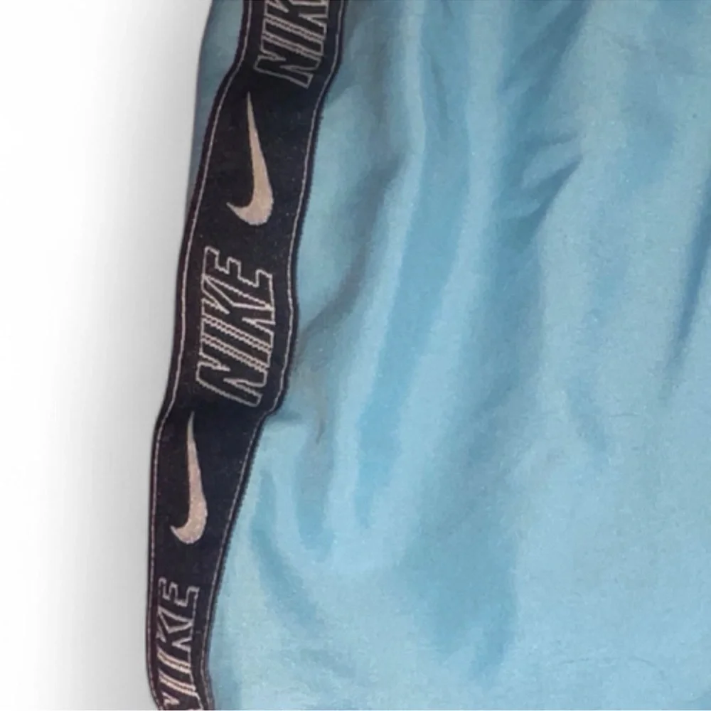 Nike boys swim trunks size 7 blue with black stripe